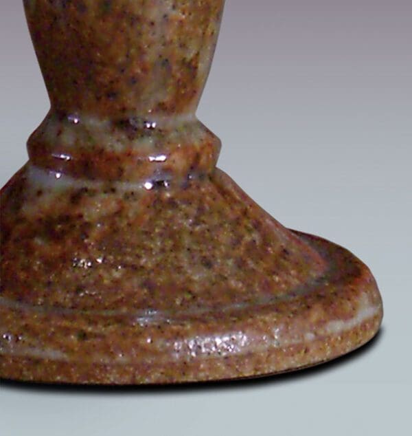 A close up of the bottom of a candle holder